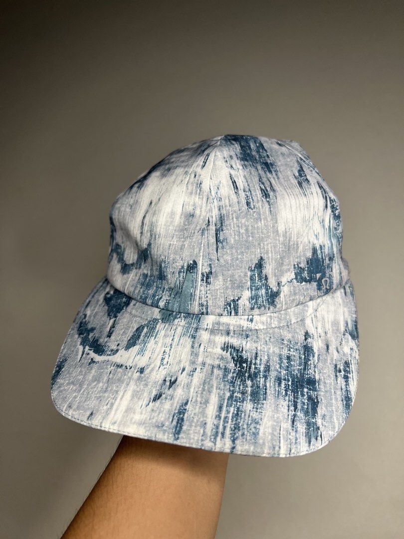 Lululemon Cap - Blue & White Tie-Dye Pattern (Category: Hats & Beanies) located in Tacloban City. Submitted by thrftg (Listing ID 1460464028, Image 1). Description: - Stylish blue and white tie-dye Lululemon cap. - Adjustable strap for a customized fit. - Crafted from a comfortable polyester and spandex blend. - Ideal for workouts or casual outings. - Designed with quality in Vancouver..