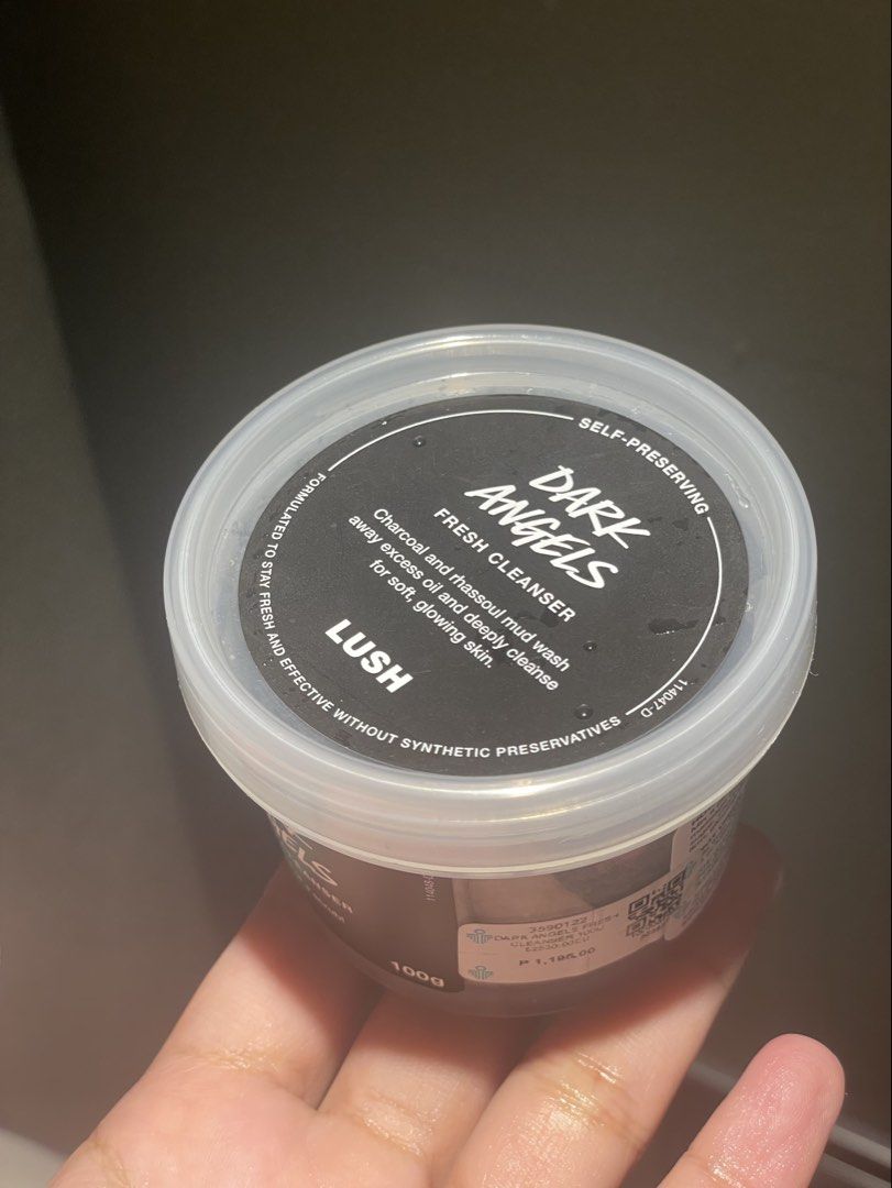 LUSH Dark Angels Fresh Cleanser (Category: Face Care) located in Quezon City. Submitted by lisadeclutters (Listing ID 1460465381, Image 1). Description: - LUSH Dark Angels Fresh Cleanser - Deeply cleanses excess oil and impurities - Contains charcoal and rhassoul mud for a powerful cleanse - Leaves skin soft and glowing - Enriched with organic avocado oil and organic cocoa butter - Size: 100g tub Just bought, used only a tiny pinch (see photo) pr