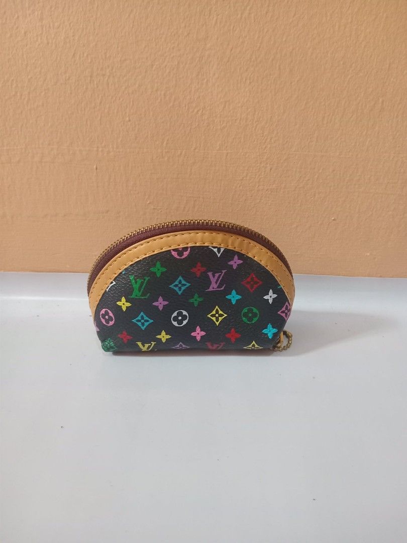 Lv Monogram Multicolore Coin Pouch (Category: Luxury Bags & Wallets) located in Urdaneta. Submitted by assortedprelovedd (Listing ID 1460361147, Image 1). Description: - Adorable coin pouch with classic LV monogram in vibrant rainbow colors. - Secure zipper closure to keep your belongings safe. - Features a small attached chain for convenience. - Ideal for organizing coins, cards, or other small essentials. - Compact and portable, easily fits int