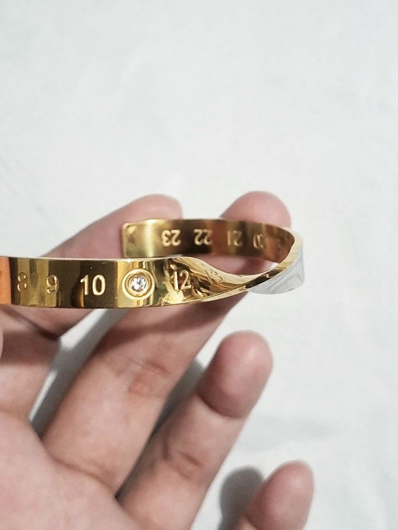 Maison Margiela Numeric Twisted Diamond Cuff Bracelet (Auth) (Category: Bracelets) located in Pasig City. Submitted by crazyrich.mnl (Listing ID 1460450750, Image 2). Description: Authentic📌 Thrifted 2nd Hand (has few small soft scratches) Rhinestone/Diamond Detail Intact. Men's size No box/inclusions, comes as is but alternative box will be provided for shipment purposes🫶🏻 Retails for $1,713 (P107,500) Message us for more info🤍 Open for offe