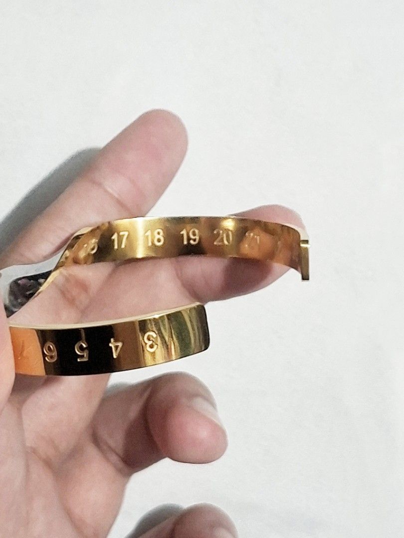 Maison Margiela Numeric Twisted Diamond Cuff Bracelet (Auth) (Category: Bracelets) located in Pasig City. Submitted by crazyrich.mnl (Listing ID 1460450750, Image 3). Description: Authentic📌 Thrifted 2nd Hand (has few small soft scratches) Rhinestone/Diamond Detail Intact. Men's size No box/inclusions, comes as is but alternative box will be provided for shipment purposes🫶🏻 Retails for $1,713 (P107,500) Message us for more info🤍 Open for offe
