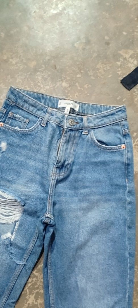 Mango Denim Mom Jeans (Category: Jeans) located in Manila. Submitted by ezekislacl02490 (Listing ID 1460422038, Image 2). Description: - Brand: Mango Denim - Color: Blue - Style: Mom Jeans - Fit: Straight Leg - Details: Ripped knees, frayed hems - Size: 32 EUR / 1 USA / 0 MEX - Occasion: Casual wear.