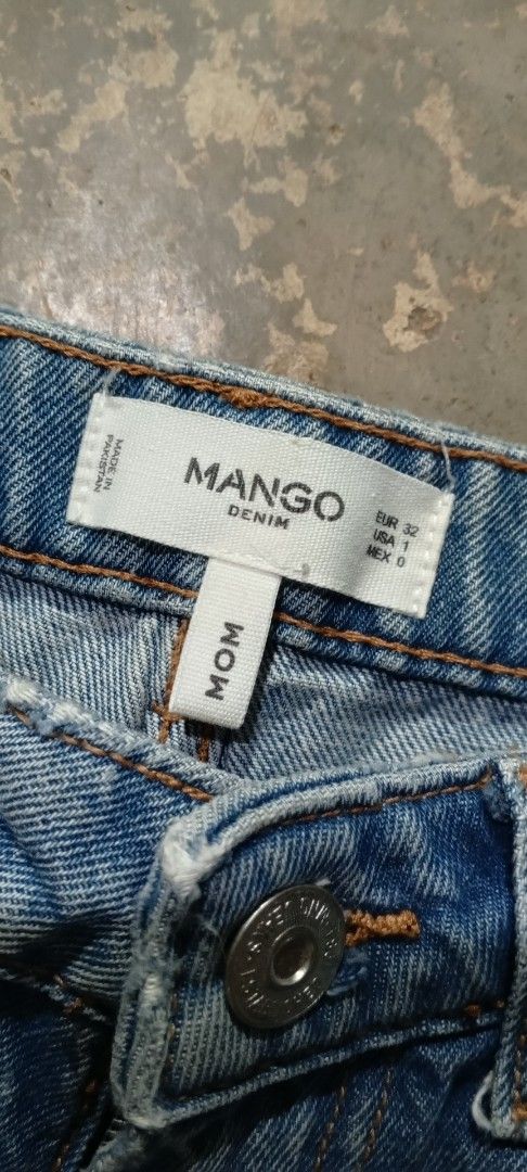 Mango Denim Mom Jeans (Category: Jeans) located in Manila. Submitted by ezekislacl02490 (Listing ID 1460422038, Image 3). Description: - Brand: Mango Denim - Color: Blue - Style: Mom Jeans - Fit: Straight Leg - Details: Ripped knees, frayed hems - Size: 32 EUR / 1 USA / 0 MEX - Occasion: Casual wear.