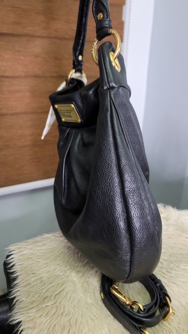 Marc by Marc Jacobs Black Leather Hobo Bag (Category: Luxury Bags & Wallets) located in Cavite. Submitted by amairos (Listing ID 1460422835, Image 3). Description: - Brand: Marc by Marc Jacobs - Style: Hobo Bag - Material: Soft, pebbled black leather - Hardware: Gold details - Features: Detachable shoulder strap, cute charm attached - Interior: Plenty of space - Occasion: Great everyday bag charm & twilly not include.