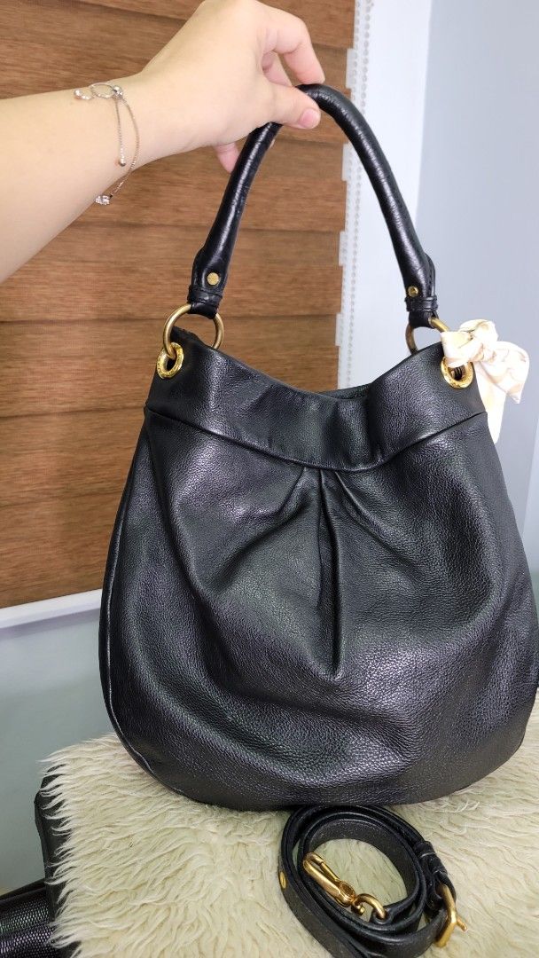 Marc by Marc Jacobs Black Leather Hobo Bag (Category: Luxury Bags & Wallets) located in Cavite. Submitted by amairos (Listing ID 1460422835, Image 2). Description: - Brand: Marc by Marc Jacobs - Style: Hobo Bag - Material: Soft, pebbled black leather - Hardware: Gold details - Features: Detachable shoulder strap, cute charm attached - Interior: Plenty of space - Occasion: Great everyday bag charm & twilly not include.