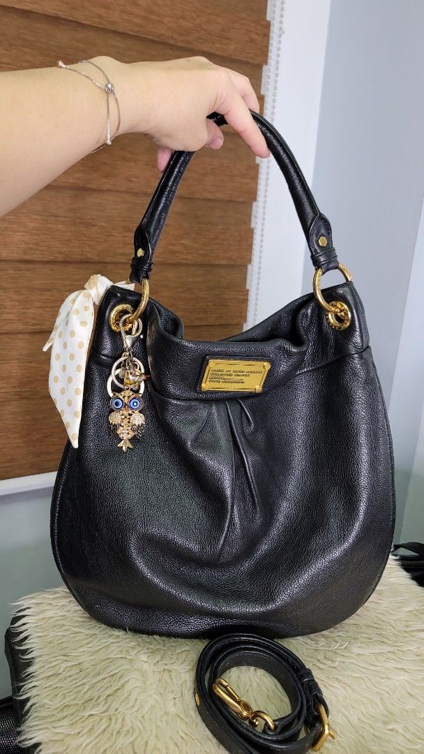 Marc by Marc Jacobs Black Leather Hobo Bag (Category: Luxury Bags & Wallets) located in Cavite. Submitted by amairos (Listing ID 1460422835, Image 1). Description: - Brand: Marc by Marc Jacobs - Style: Hobo Bag - Material: Soft, pebbled black leather - Hardware: Gold details - Features: Detachable shoulder strap, cute charm attached - Interior: Plenty of space - Occasion: Great everyday bag charm & twilly not include.