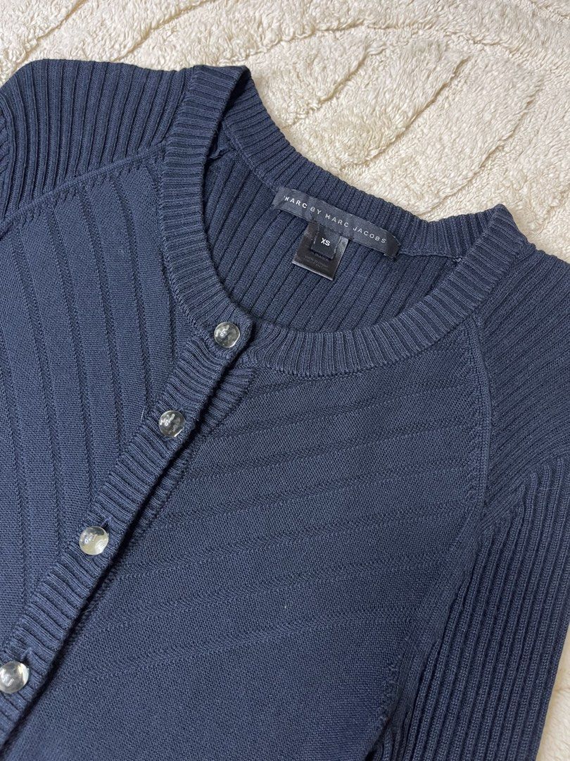 Marc by Marc Jacobs Navy Blue Button Up Cardigan (Category: Coats, Jackets and Outerwear) located in Manila. Submitted by jesteeer (Listing ID 1460442317, Image 2). Description: Marc by Marc Jacobs Knitted Cardigan - Size: XS -Button-up with MJ logo buttons w - 14 stretchable l - 27 Good Condition No Issue 350 shipped only 📍Tondo Manila.