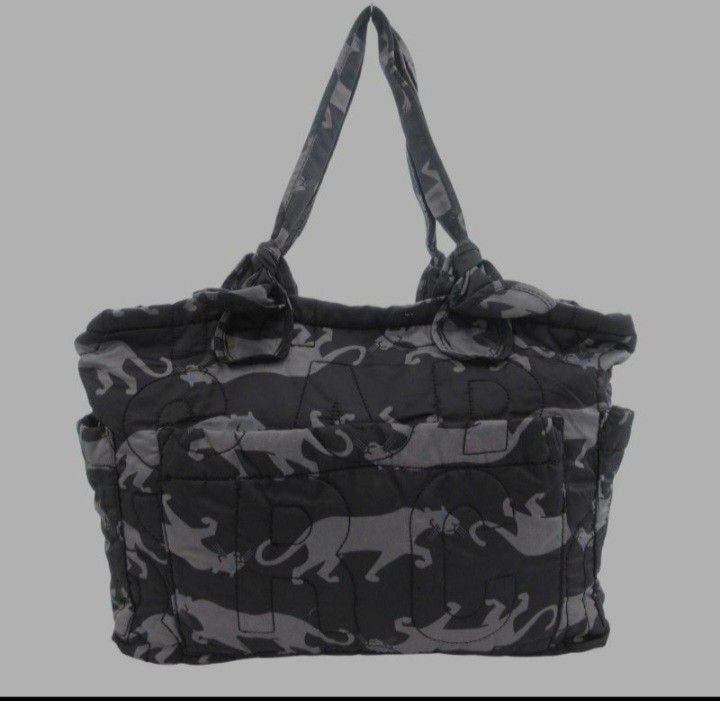 Marc by Marc Jacobs Standard Supply Puffer Tote Bag (Category: Luxury Bags & Wallets) located in Navotas City. Submitted by riyuwi (Listing ID 1460408699, Image 3). Description: PreOwned Likenew Authentic Marc Jacobs Stylish Printed quilted tote bag greyish black Large - Unique tiger print with black and grey camouflage - Interior lining features all-over Marc Jacobs logo - Convenient side pockets - Comfortable top handles - Spacious interior for