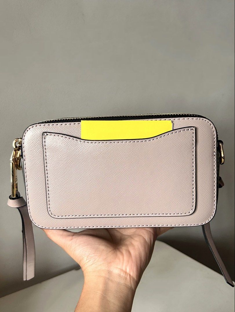 Marc Jacobs Snapshot Camera Bag Pink (Category: Luxury Bags & Wallets) located in Manila. Submitted by lyly_0 (Listing ID 1460308098, Image 3). Description: - Authentic Marc Jacobs Snapshot Bag - Bought sa US - Includes original strap with Marc Jacobs logo - Front zip pocket with signature gold 'J' detail - Convenient back slip pocket - Ideal for everyday wear and styling.