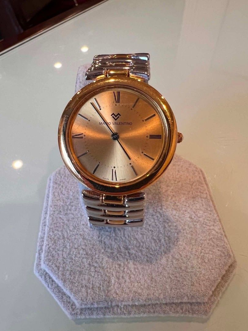 Mario Valentino Rose Gold Watch (Category: Women's Watches) located in Manila. Submitted by jiainah (Listing ID 1460383652, Image 1). Description: - Rose gold watch with champagne dial - Features a Roman numeral at 12 o'clock - Swiss made for quality craftsmanship - Stylish two-tone metal bracelet - Classic and simple design - Versatile for everyday wear or special occasions.