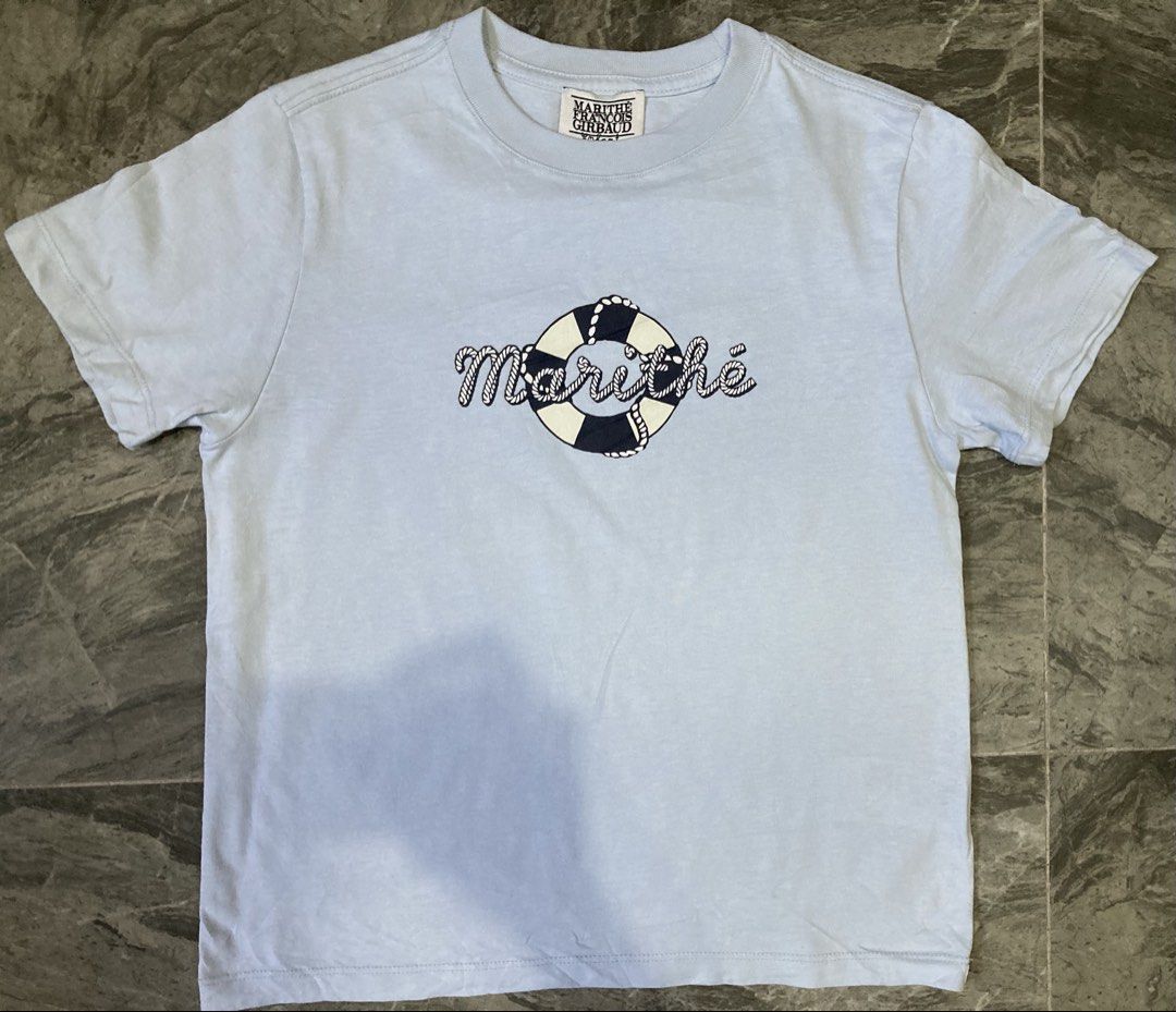 Marithe&Francois Girbaud Kids Tshirt (Category: Babies & Kids Fashion) located in General Santos City (Dadiangas). Submitted by amorhesthrift (Listing ID 1460382551, Image 2). Description: New condition Size-8-10Y Kasya adult-Xs-Small This is a light blue children’s t-shirt from Marithé + François Girbaud Enfant featuring a floating life preserver tube logo design.