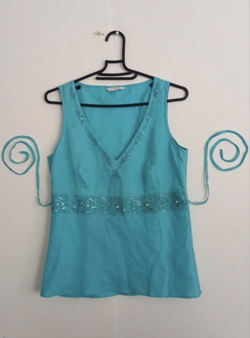 Marks & Spencers Turquoise Beaded Top (Category: Sleeveless) located in Manila. Submitted by secondsbyem (Listing ID 1460380831, Image 1). Description: Fabric: Linen Size: B34 | L23 Details: V-neckline with beaded embellishments. A beaded band cinches the waist. tags: teal , turquoise, cyan .