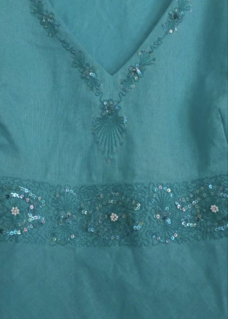 Marks & Spencers Turquoise Beaded Top (Category: Sleeveless) located in Manila. Submitted by secondsbyem (Listing ID 1460380831, Image 2). Description: Fabric: Linen Size: B34 | L23 Details: V-neckline with beaded embellishments. A beaded band cinches the waist. tags: teal , turquoise, cyan .