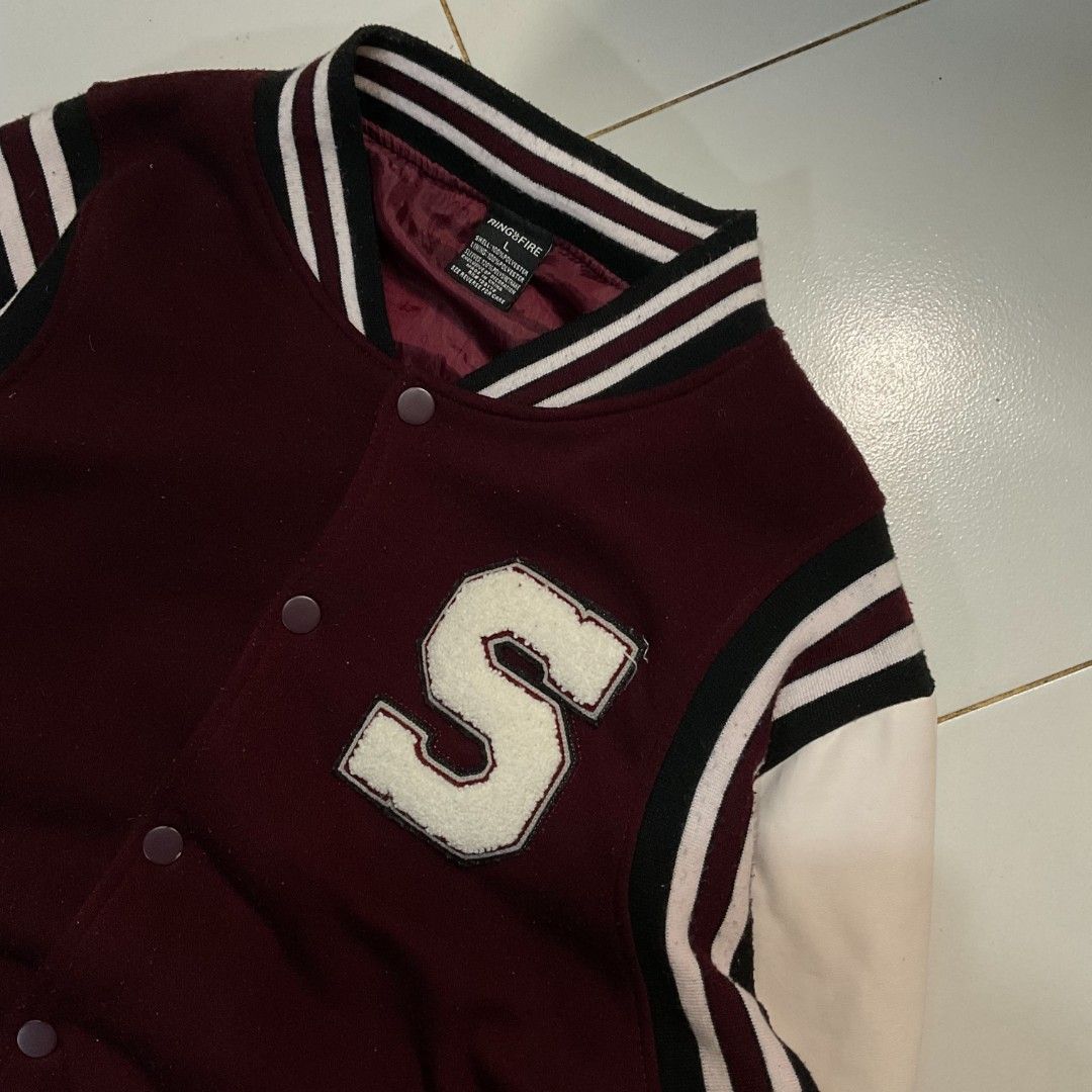 MAROON & WHITE 'S' LETTERMAN VARSITY JACKET (Category: Coats, Jackets and Outerwear) located in Morong. Submitted by rusty.vault (Listing ID 1460416101, Image 2). Description: - Classic maroon and white varsity jacket - Features a prominent 'S' patch on the chest - Ribbed cuffs, collar, and hem with stripe details - Button-up front closure - Ideal for a casual, sporty aesthetic - Perfect for cooler weather.