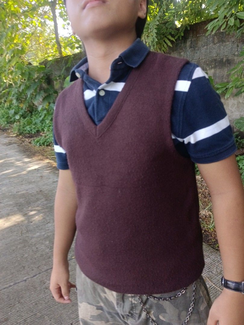 Maroon V-Neck Knit Sweater Vest (Category: Sleeveless) located in Manila. Submitted by corsethrift (Listing ID 1460410959, Image 3). Description: - Maroon knit sweater vest - V-neck design - Ideal for layering over a polo shirt - Provides extra warmth - Casual style, perfect for everyday wear.