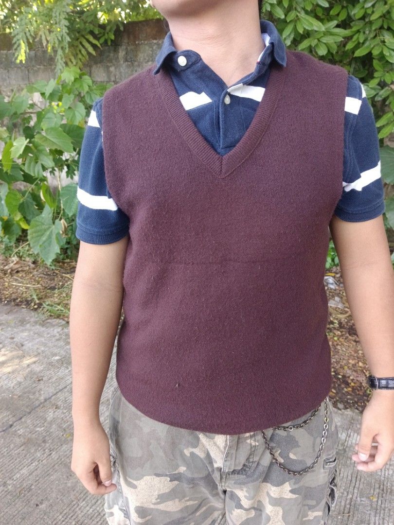 Maroon V-Neck Knit Sweater Vest (Category: Sleeveless) located in Manila. Submitted by corsethrift (Listing ID 1460410959, Image 2). Description: - Maroon knit sweater vest - V-neck design - Ideal for layering over a polo shirt - Provides extra warmth - Casual style, perfect for everyday wear.
