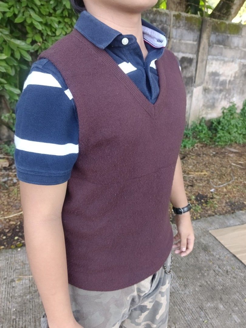 Maroon V-Neck Knit Sweater Vest (Category: Sleeveless) located in Manila. Submitted by corsethrift (Listing ID 1460410959, Image 1). Description: - Maroon knit sweater vest - V-neck design - Ideal for layering over a polo shirt - Provides extra warmth - Casual style, perfect for everyday wear.