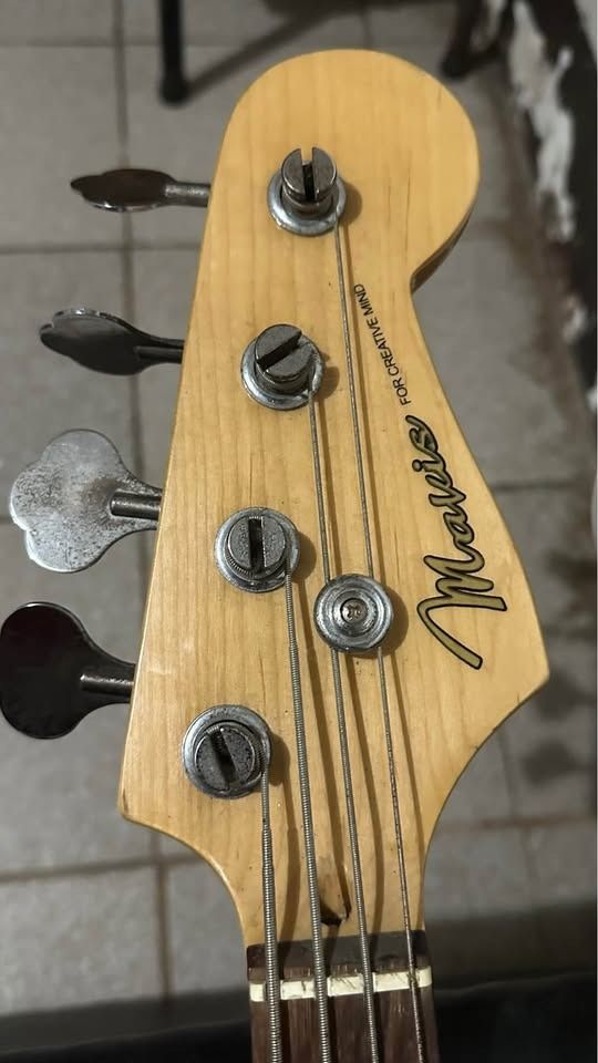 MAVIS ISHIBASHI BASS GUITAR (Category: Musical Instruments) located in Binangonan. Submitted by rullanjm3528769 (Listing ID 1460311646, Image 3). Description: 1 item only * Brand: Mavis by Ishibashi Music (Ishibashi’s house/starter brand) * Type: Jazz Bass-style, 4-string * Scale: 34” / 864 mm * Body: Solid wood; some documented models list alder * Neck: Hard maple * Fingerboard: Rosewood * Pickups: 2 × Jazz Bass-style single coils * Controls: 2 