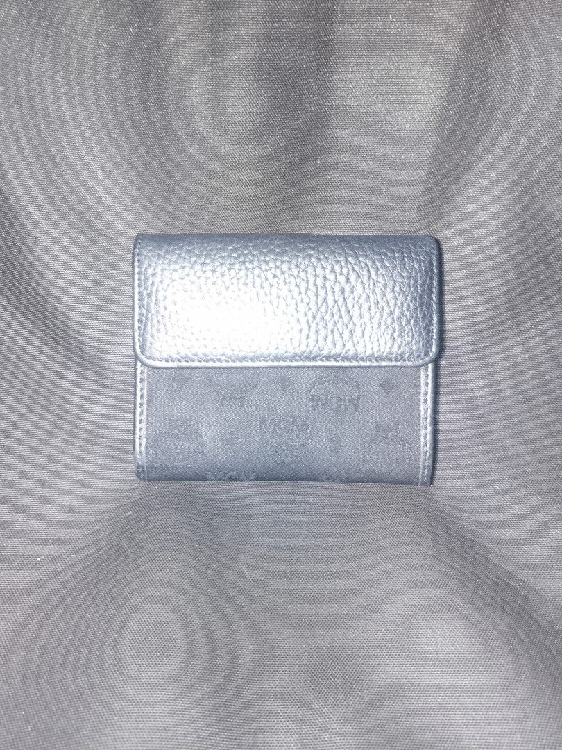 MCM Bifold Wallet Monogram Canvas Leather (Category: Luxury Bags & Wallets) located in San Juan City. Submitted by swiftfox.62e2f4 (Listing ID 1460311160, Image 2). Description: - Authentic MCM wallet - Classic MCM monogram pattern on canvas with leather trim - Bifold design - Multiple card slots - Coin compartment - Snap closure - Shows some signs of wear, but fully functional - Great for everyday use.