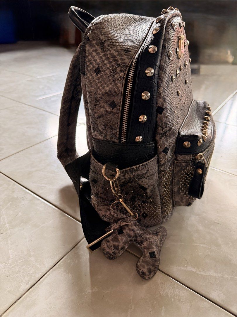 MCM Studded Python Print Backpack (Category: Backpacks) located in Puerto Princesa. Submitted by katsab (Listing ID 1460362293, Image 2). Description: 👜 FOR SALE: MCM Z8364 BAG 👜 ✨ Elegant and timeless MCM design ✨ Signature MCM monogram pattern ✨ Stylish and versatile—perfect for everyday use or special occasions ✨ Spacious enough for your essentials ✨ A must-have for MCM lovers and luxury bag collectors 📩 Send me a message for more details, 