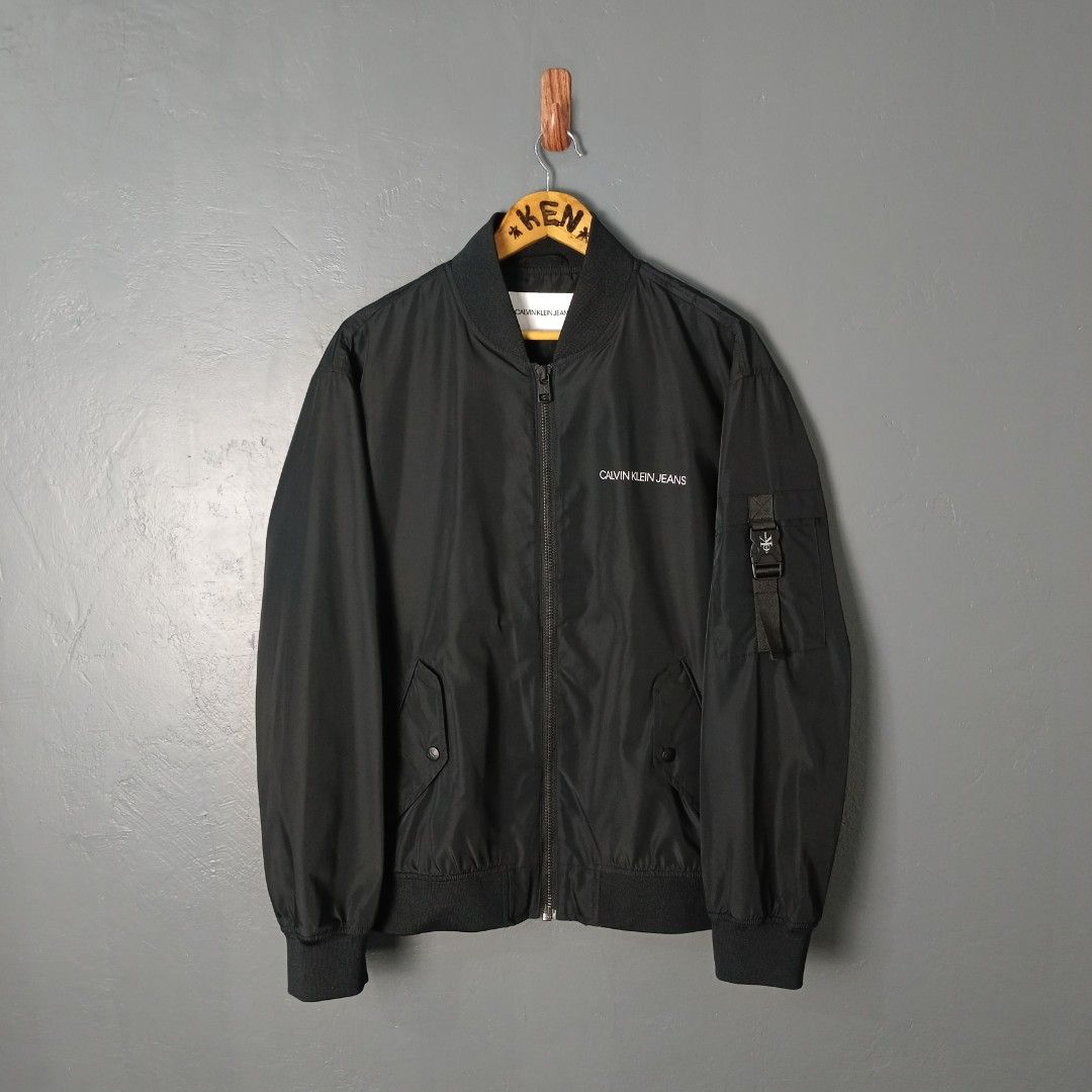 Men's - Calvin Klein (Category: Coats, Jackets and Outerwear) located in Bacolod City. Submitted by drop.ph (Listing ID 1460387299, Image 2). Description: Calvin Klein - Bomber Jacket Authentic *Size M fits L - 24x26 *Excellent *No Flaws *Price: 2,500php *Add SF if outside Bacolod City .