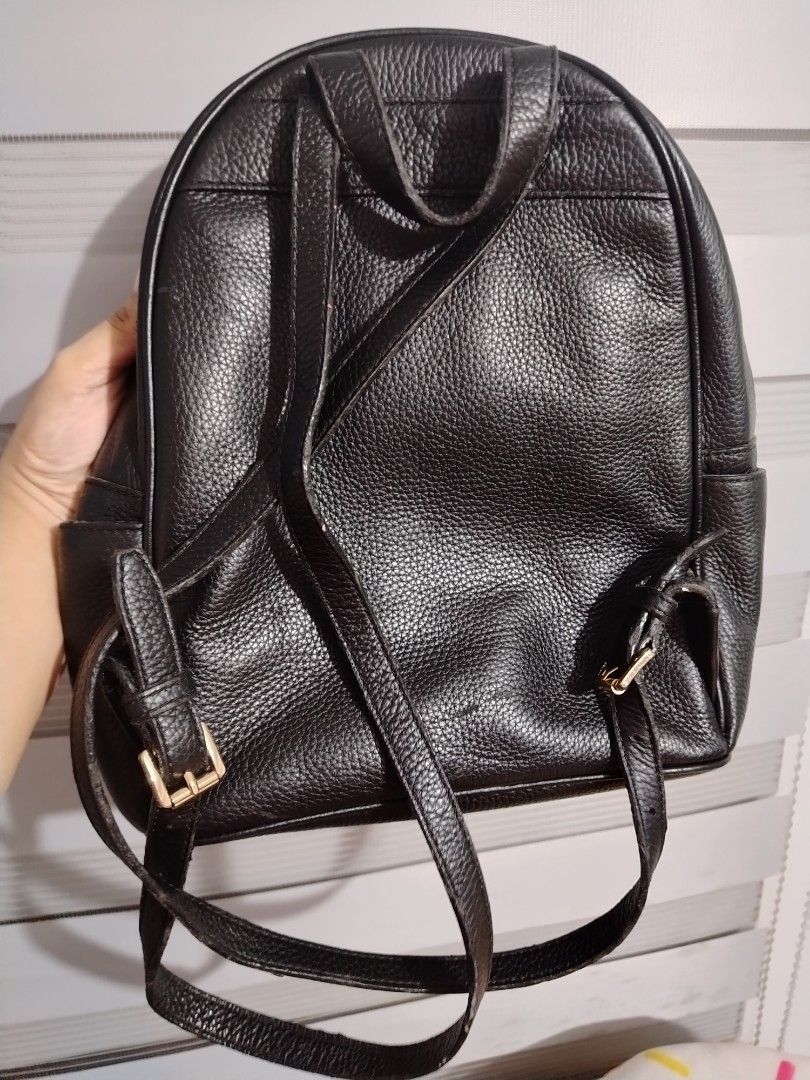 Michael Kors Black Leather Studded Backpack (Category: Backpacks) located in Santa Maria. Submitted by gratefulforever (Listing ID 1460488675, Image 3). Description: - Genuine Michael Kors black leather backpack - Eye-catching gold-tone studs on front pocket and body - Secure zipper closure with branded pulls - Adjustable shoulder straps for comfort - Ideal for everyday errands or your next adventure.