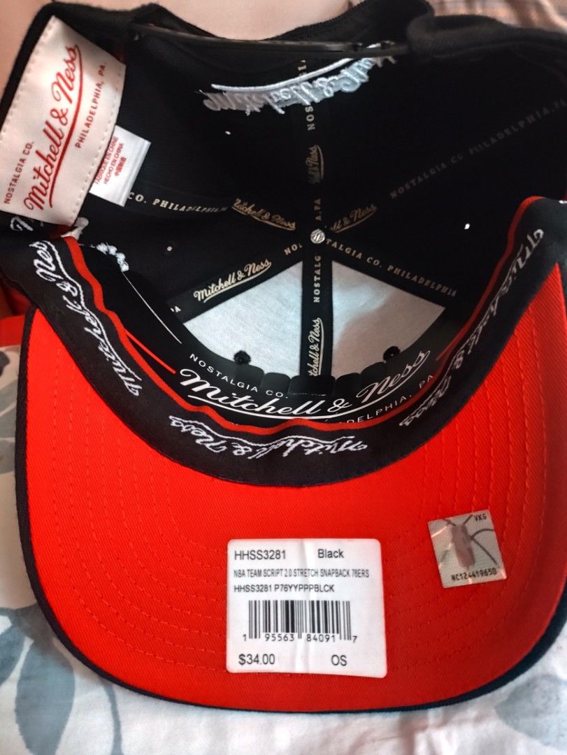 Mitchell & Ness Philadelphia 76ers Classic Red Stretch Snapback Cap (Category: Caps & Hats) located in Dasmarinas. Submitted by rocksteadypao0315 (Listing ID 1460357636, Image 3). Description: - Brand: Mitchell & Ness - Team: Philadelphia 76ers - Color: Black with red accents - Front Design: Red script team name - Side Design: Classic 76 logo - Fit: Adjustable stretch snapback - Underbrim: Red - Ideal for: Any 76ers fan.