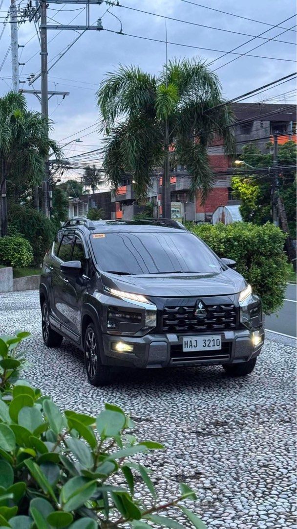 Mitsubishi Xpander Cross (New Look) Auto (Category: Used Cars) located in Manila. Submitted by quality_cars (Listing ID 1460412735, Image 2). Description: FOR SALE‼️ Mitsubishi Xpander Cross ( New Look ) 2026 model - Green Bronze Metallic 2k flat mileage. ( PASS AS BRANDNEW ) Price: ₱1,045,000 negotiable, - With 2 Original Car Keys - With Service Record & Manual Booklet - Equipped with 360 Camera - Mags casa marking still intact - Interior and Ex