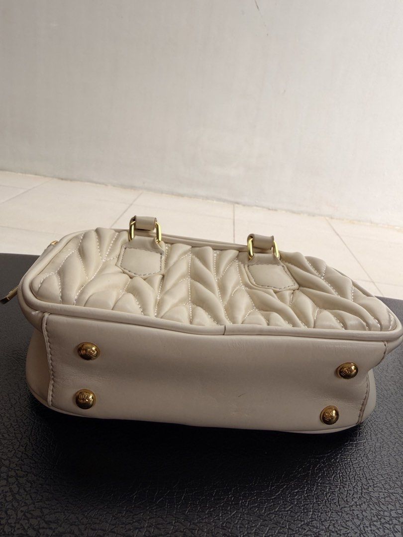 Miu miu white bag (Category: Tote Bags) located in Antipolo. Submitted by 2ammom (Listing ID 1460335009, Image 3). Description: missing sling clean interior puffer style small but can fit 17 pro max phone.