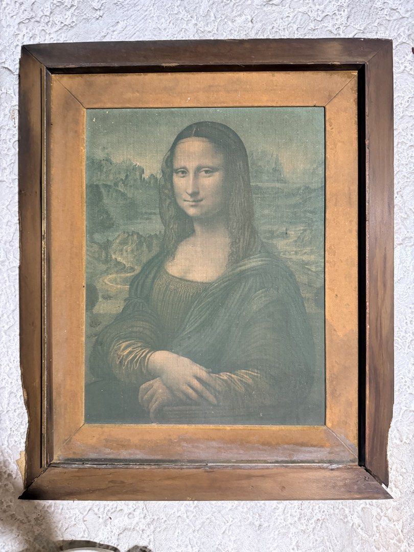 Mona Lisa Print - Classic Art Reproduction (Category: Art & Prints) located in Quezon City. Submitted by loi1112 (Listing ID 1460414859, Image 1). Description: - Vintage framed print of the iconic Mona Lisa. - Features a rustic, wooden frame. - Artwork has a classic, aged aesthetic. - Ideal for art enthusiasts and home decoration. - Comes ready to hang on your wall..