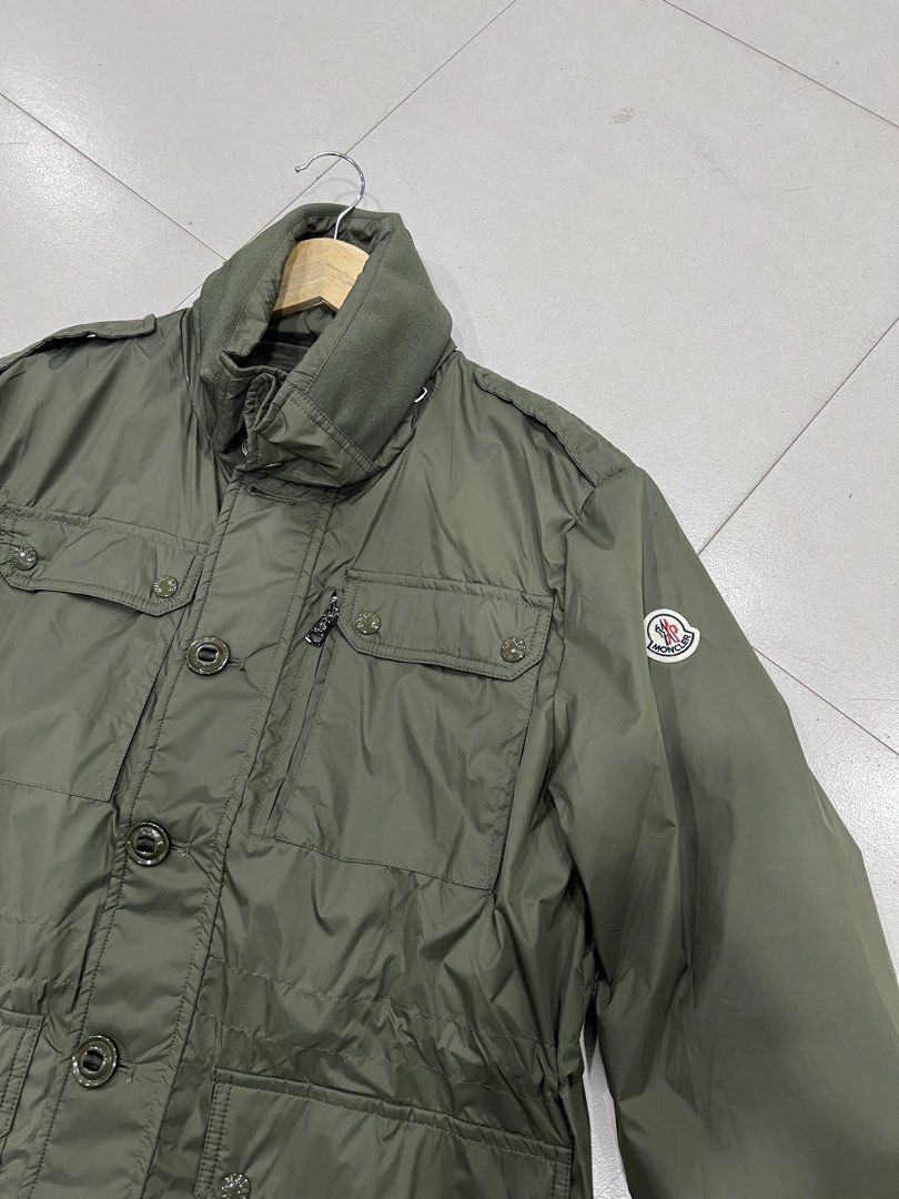 Moncler Olive Green Military Style Jacket (Category: Coats, Jackets and Outerwear) located in Manila. Submitted by royalbear-872f8c (Listing ID 1460393949, Image 2). Description: - Olive green Moncler jacket - Military-inspired design - Multiple functional pockets - Secure button and zip closure - Iconic Moncler logo on sleeve - Ideal for layering in cooler weather - Please check photos for detailed condition.