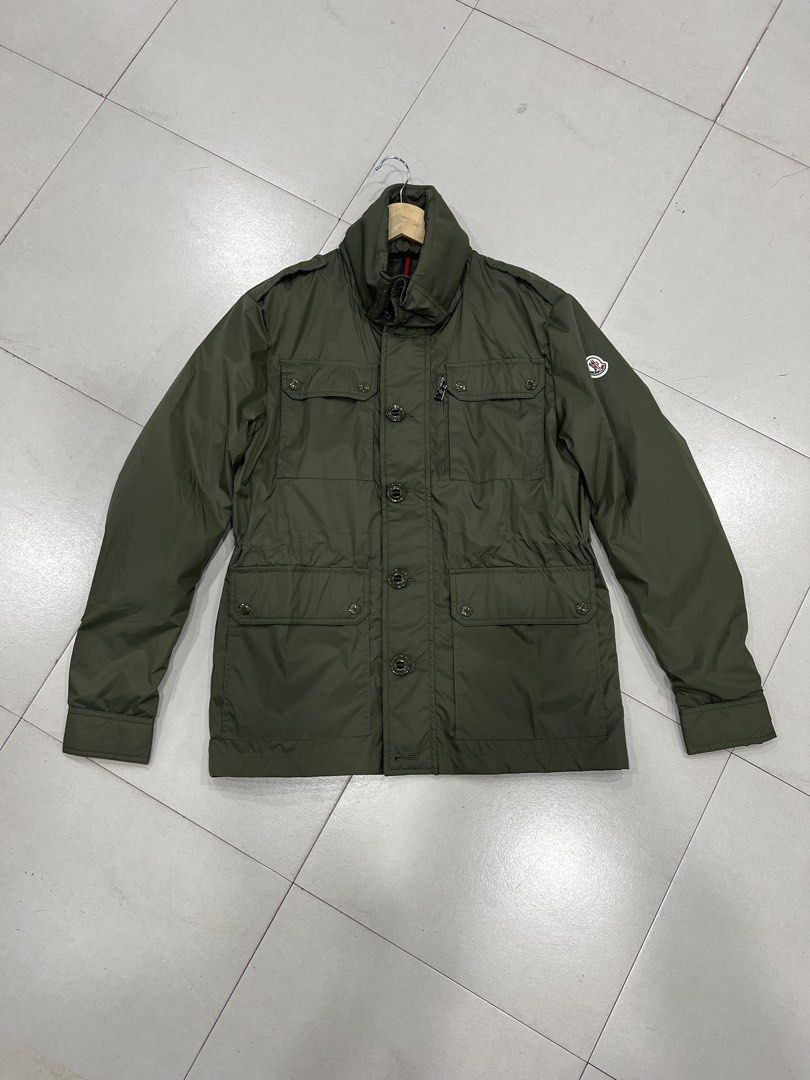Moncler Olive Green Military Style Jacket (Category: Coats, Jackets and Outerwear) located in Manila. Submitted by royalbear-872f8c (Listing ID 1460393949, Image 1). Description: - Olive green Moncler jacket - Military-inspired design - Multiple functional pockets - Secure button and zip closure - Iconic Moncler logo on sleeve - Ideal for layering in cooler weather - Please check photos for detailed condition.