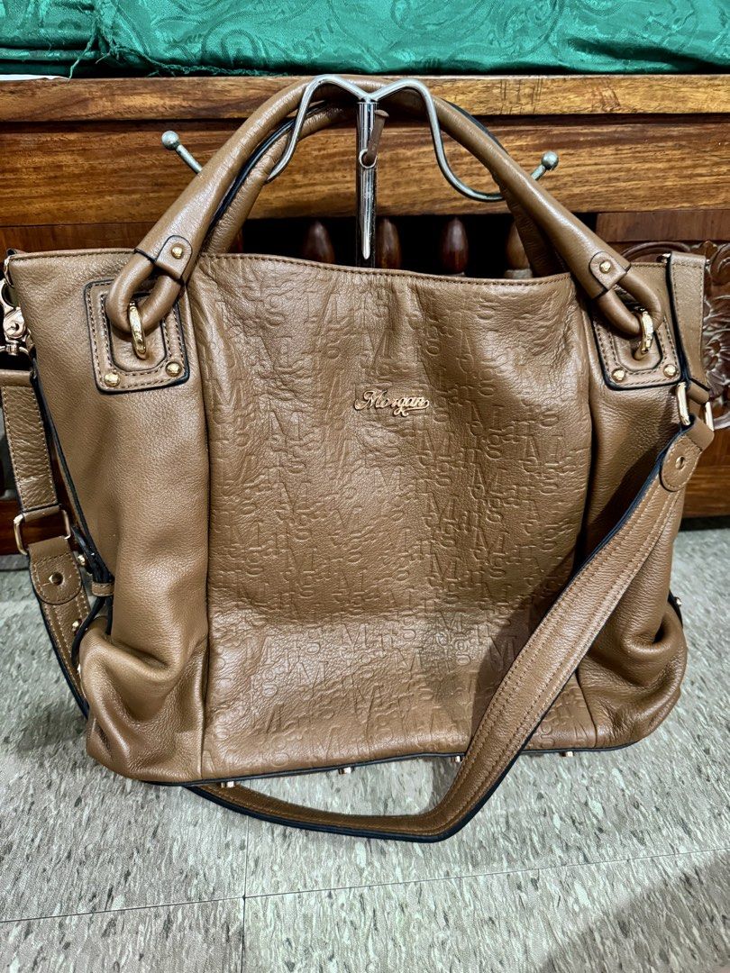Morgan Brown Leather Embossed Shoulder Bag (Category: Shoulder Bags) located in Imus. Submitted by avielicious (Listing ID 1460394164, Image 1). Description: - Brand: Morgan - Material: Brown Leather - Design: All-over embossed pattern - Straps: Top handles and detachable shoulder strap - Hardware: Gold-tone - Interior: Spacious - Use: Great for everyday.