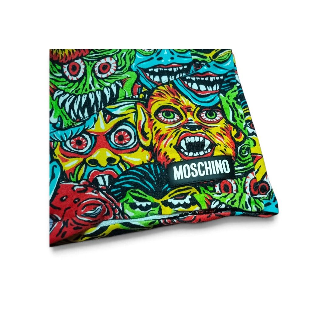 Moschino Monster Print Shorts (Category: Babies & Kids Fashion) located in Manila. Submitted by southstreethub.ph (Listing ID 1460430019, Image 2). Description: - Eye-catching Moschino shorts with a fun, all-over monster print. - Vibrant, bright colors that stand out. - Comfortable elastic waistband with an adjustable drawstring. - Size: 24-26 Waist - Ideal for summer wear or casual lounging. - Refer to pictures for detailed condition..