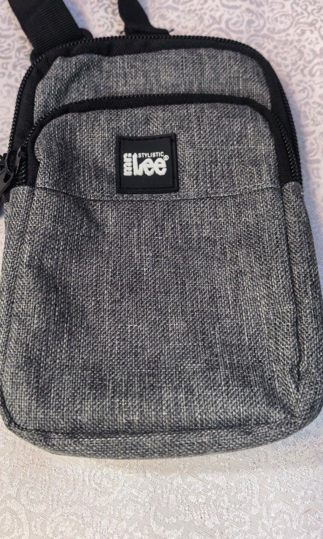 Mr stylistic Lee gray cross body bag (Category: Cross-body Bags) located in Tuguegarao City. Submitted by zenphoenix-7ad615 (Listing ID 1460354694, Image 2). Description: Brand new Cellphone sling.