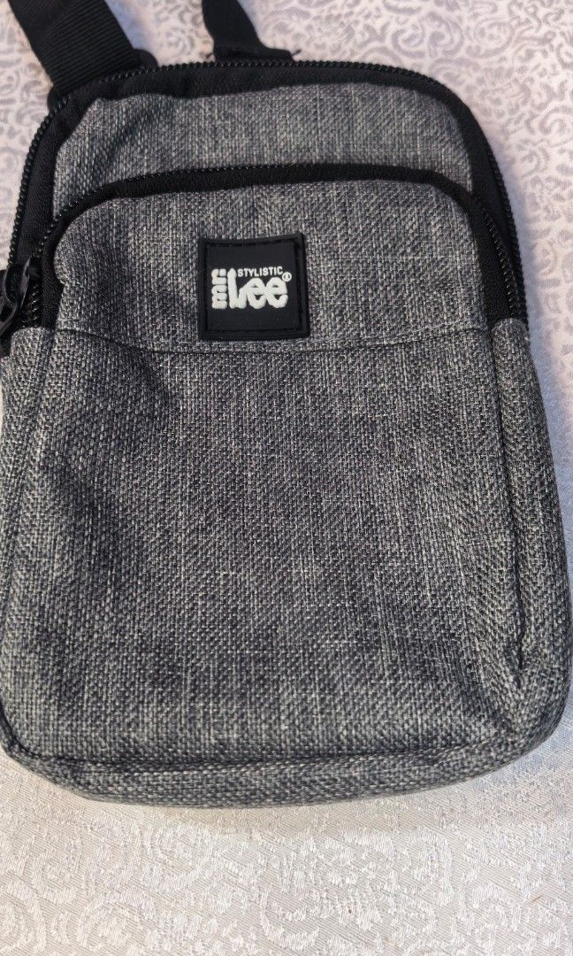 Mr stylistic Lee gray cross body bag (Category: Cross-body Bags) located in Tuguegarao City. Submitted by zenphoenix-7ad615 (Listing ID 1460354694, Image 1). Description: Brand new Cellphone sling.