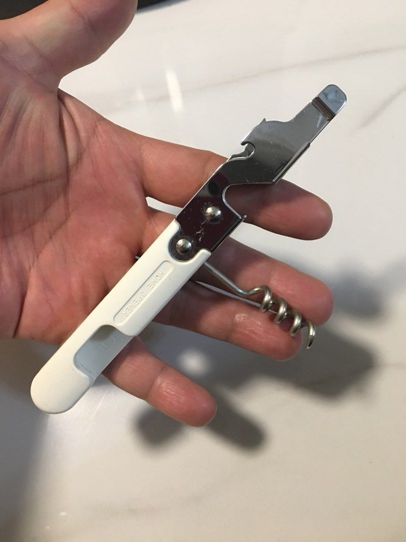 Multi-function Kitchen Tool - Can Opener, Bottle Opener, Corkscrew (Category: Other Kitchenware & Tableware) located in Pasay City. Submitted by gilbertso62551 (Listing ID 1460463546, Image 3). Description: - Versatile 3-in-1 kitchen gadget - Functions: Can opener, bottle opener, corkscrew - Features a comfortable white plastic handle - Durable, shiny metal components - Ideal for everyday kitchen use or outdoor adventures like picnics.
