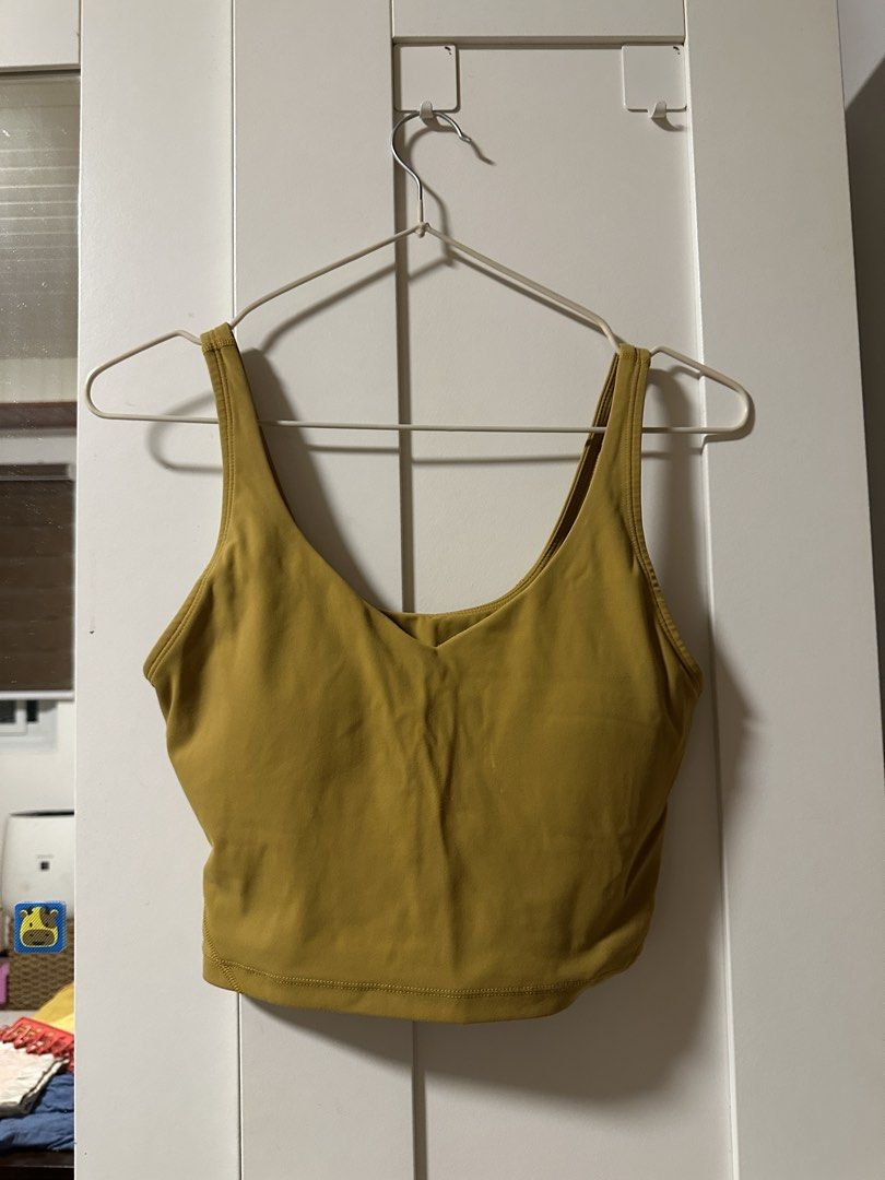 Mustard Yellow Cropped Tank Top (Category: Activewear) located in Malolos. Submitted by fituccine (Listing ID 1460418198, Image 1). Description: - Yellow cropped tank top - V-neckline with thick straps - Stretchy and comfortable material - Ideal for workouts or casual wear - Versatile: pairs well with shorts or leggings.