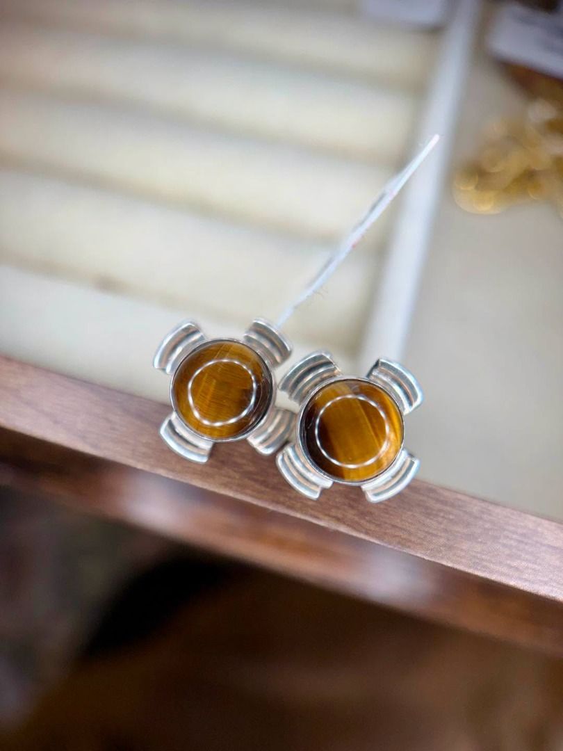 Natural Tiger’s Eye in Vintage Silver Setting (Category: Earrings) located in Baguio. Submitted by asna_taku (Listing ID 1460430815, Image 1). Description: 🐅 Natural Tiger’s Eye in Vintage Silver Setting A bold vintage find with that mesmerizing golden-brown glow. ✨ Featuring natural Tiger’s Eye cabochons with a beautiful chatoyant band that shifts as it catches the light. Set in a distinctive vintage silver design, these studs have a strong, ti