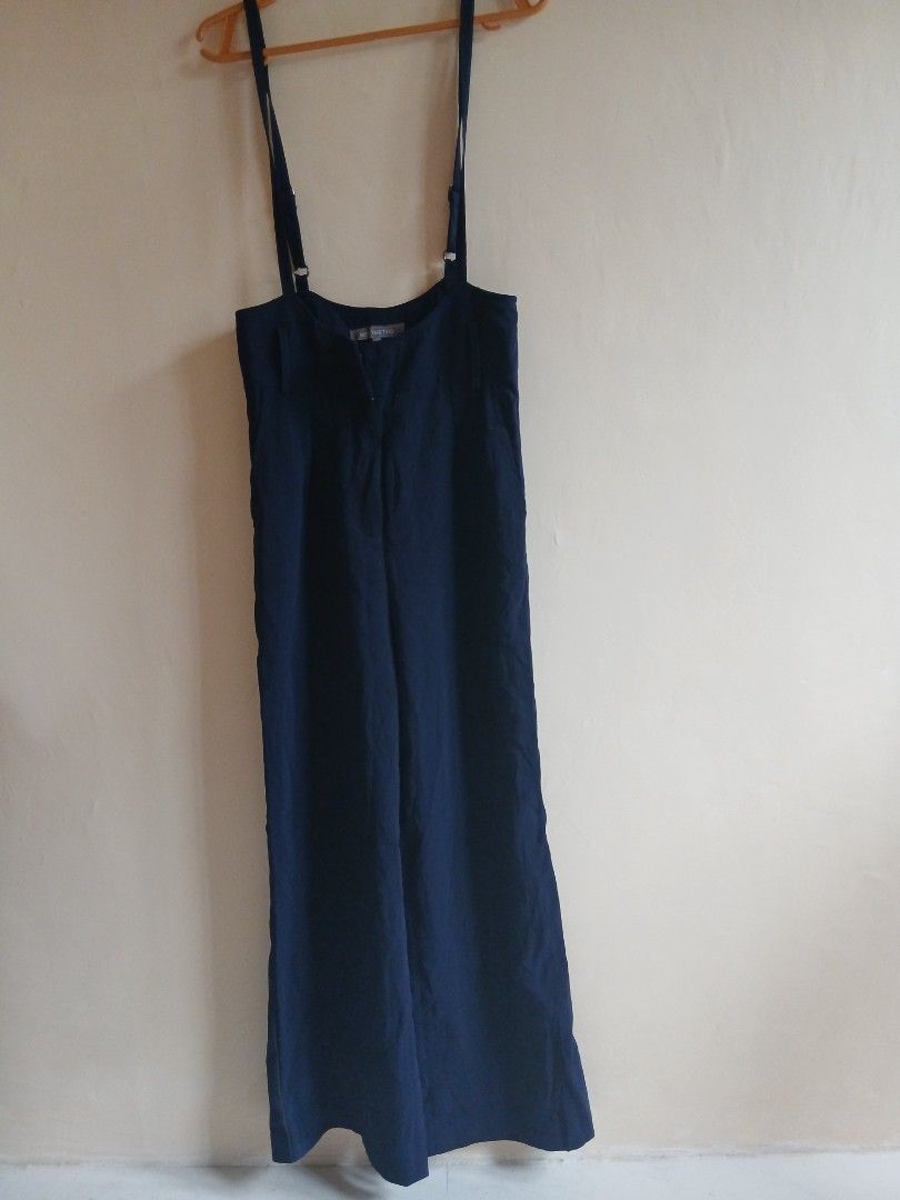 Navy Blue Jumpsuit with Adjustable Straps (Category: Jumpsuits) located in Tayabas. Submitted by ahrcelllego (Listing ID 1460318678, Image 1). Description: - Chic navy blue jumpsuit - Adjustable straps with stylish buckle details - Flattering wide-leg design - Made from soft, flowy fabric for ultimate comfort - Versatile: perfect for casual days or elegant evenings.