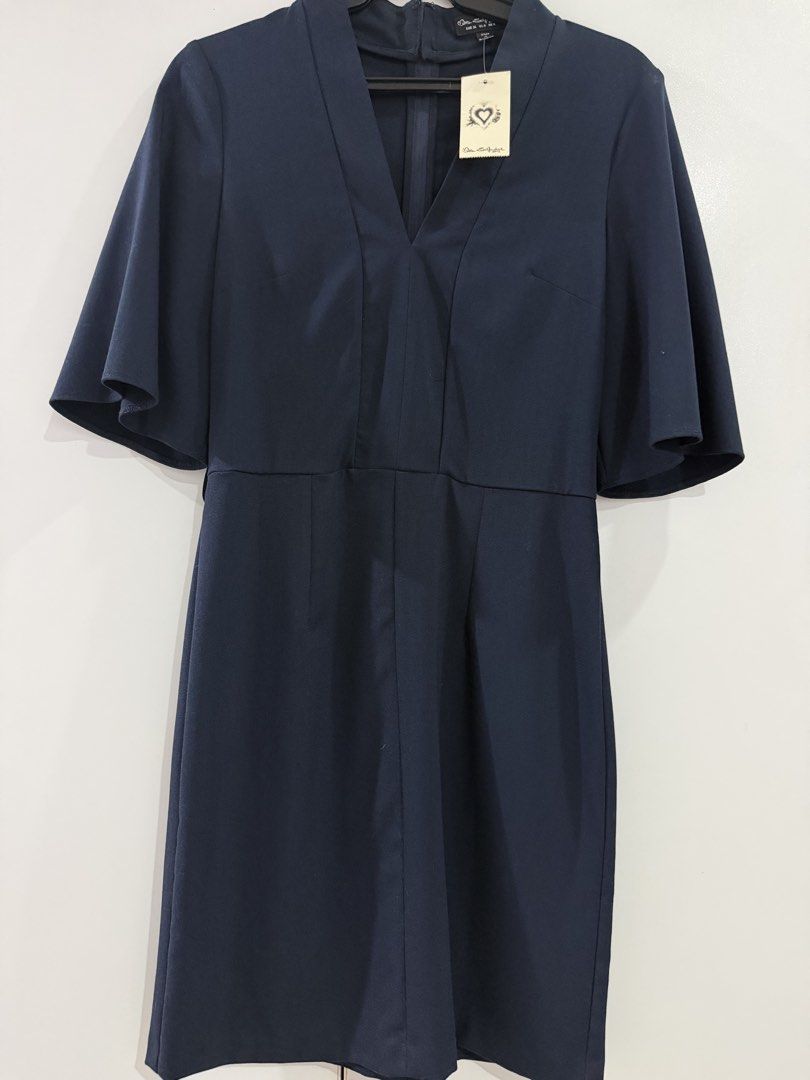 Navy Blue V-Neck Flutter Sleeve Dress (Category: Dresses) located in Manila. Submitted by nicolebrave (Listing ID 1460416746, Image 2). Description: - Navy blue V-neck dress - Flutter sleeves - Knee-length - Fitted waist - Back zip closure - Versatile for work or casual outings - Simple and classic design.