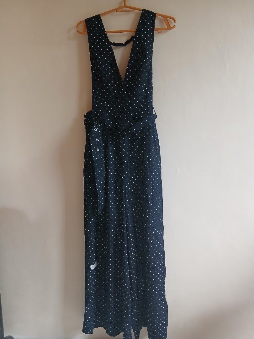 Navy Polka Dot Jumpsuit (Category: Jumpsuits) located in Tayabas. Submitted by ahrcelllego (Listing ID 1460317831, Image 1). Description: - Navy jumpsuit with classic white polka dots - Flattering V-neckline with adjustable straps - Button details down the front for a stylish touch - Trendy wide-leg design for comfort and style - Versatile piece: perfect for casual outings or evening events - Effortlessly comfortable and chic.