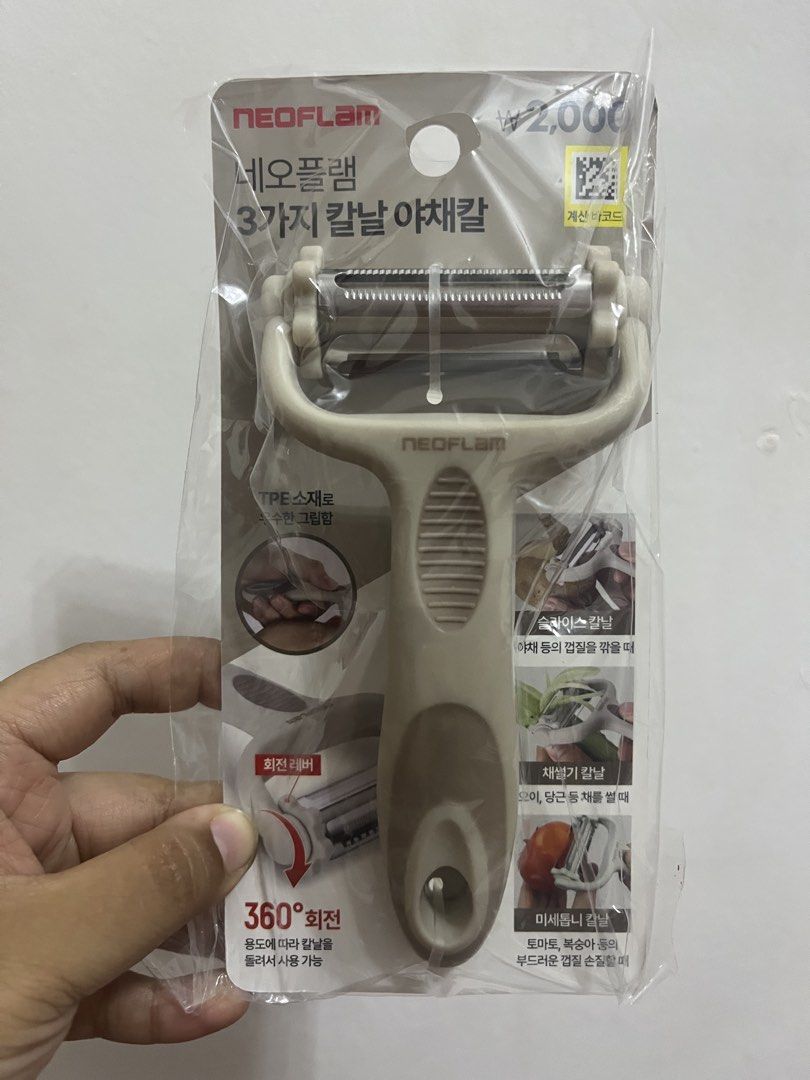 NEOFLAM 3-Blade Swivel Peeler (Category: Other Kitchenware & Tableware) located in Dasmarinas. Submitted by purpleboxmidori (Listing ID 1460471424, Image 1). Description: - NEOFLAM 3-in-1 Vegetable Peeler - Includes 3 blades: Slice, Shred, and Fine Serrated (for soft fruits) - 360° Swivel Head for effortless peeling - Comfortable Grip made with TPE material - Ideal for all your everyday kitchen tasks.