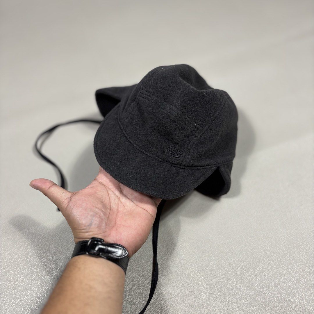New balance black fleece 5-panel cap with fold-down ear flaps and tie strings (Category: Caps & Hats) located in Quezon City. Submitted by dufflebag_boy (Listing ID 1460354879, Image 1). Description: New balance black fleece 5-panel cap with fold-down ear flaps and tie strings -Price: 550 -Size: Osfa -Good Condition HMU 📩.