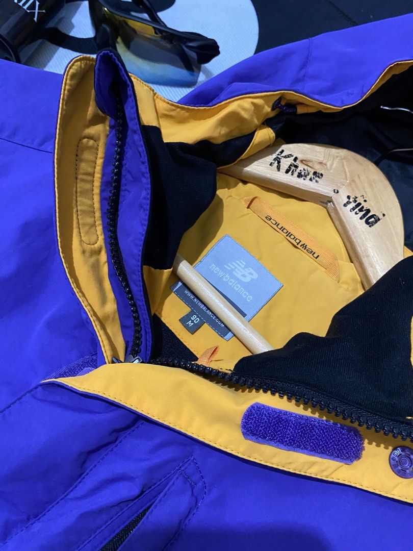 New Balance Purple Hooded Jacket (Category: Coats, Jackets and Outerwear) located in Cateel. Submitted by khan.find_ (Listing ID 1460329295, Image 3). Description: - Purple New Balance jacket with hood - Yellow lining inside - Chest pocket and two side pockets - Elasticated cuffs - Lightweight and easy to pack - Ideal for outdoor activities or casual wear.