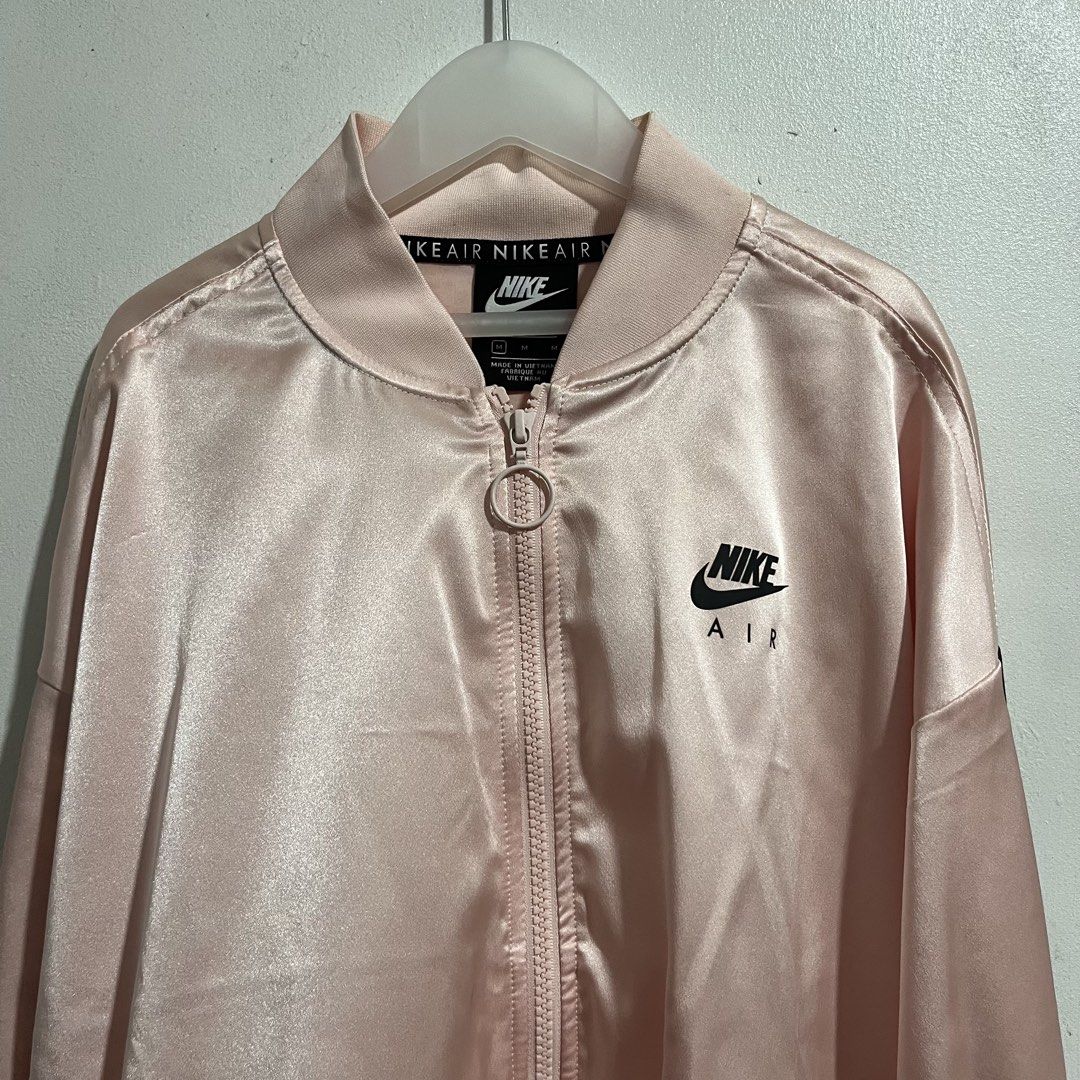 Nike Air Rose Gold Bomber Jacket (Category: Coats, Jackets and Outerwear) located in San Pedro. Submitted by raventyresep (Listing ID 1460452452, Image 1). Description: - authentic - used once only - no flaws, just needs wash - semi cropped fit .