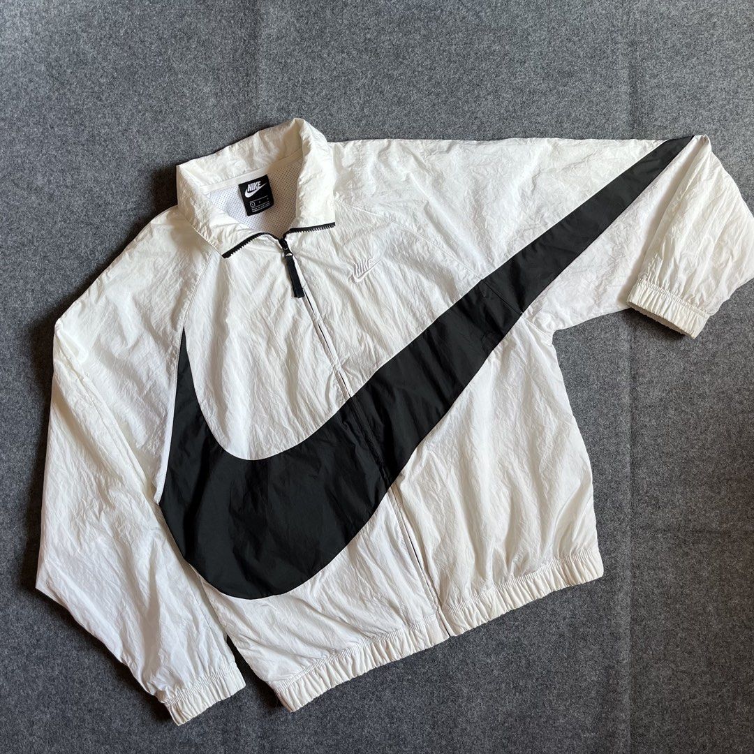 Nike Big Swoosh White Windbreaker Jacket (Category: Coats, Jackets and Outerwear) located in Cebu City. Submitted by booksii3232 (Listing ID 1460350553, Image 1). Description: - White Nike windbreaker jacket - Large black swoosh design - Quarter zip closure - Inner mesh lining for breathability - Made in Vietnam - Size: Large.