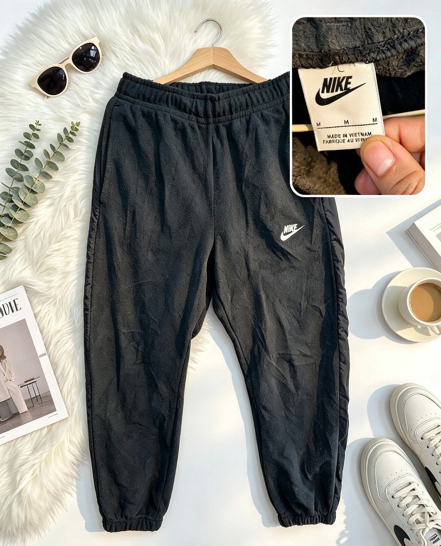 Nike Black Fleece Sweatpants Size M (Category: Joggers) located in Manila. Submitted by momofunodos (Listing ID 1460446328, Image 1). Description: - Black Nike sweatpants - Soft fleece material for ultimate comfort - Elastic waistband with adjustable drawstring - Cuffed ankles for a snug fit - Small, iconic Nike logo on the left leg - Made in Vietnam - Ideal for both relaxing at home and active workouts.