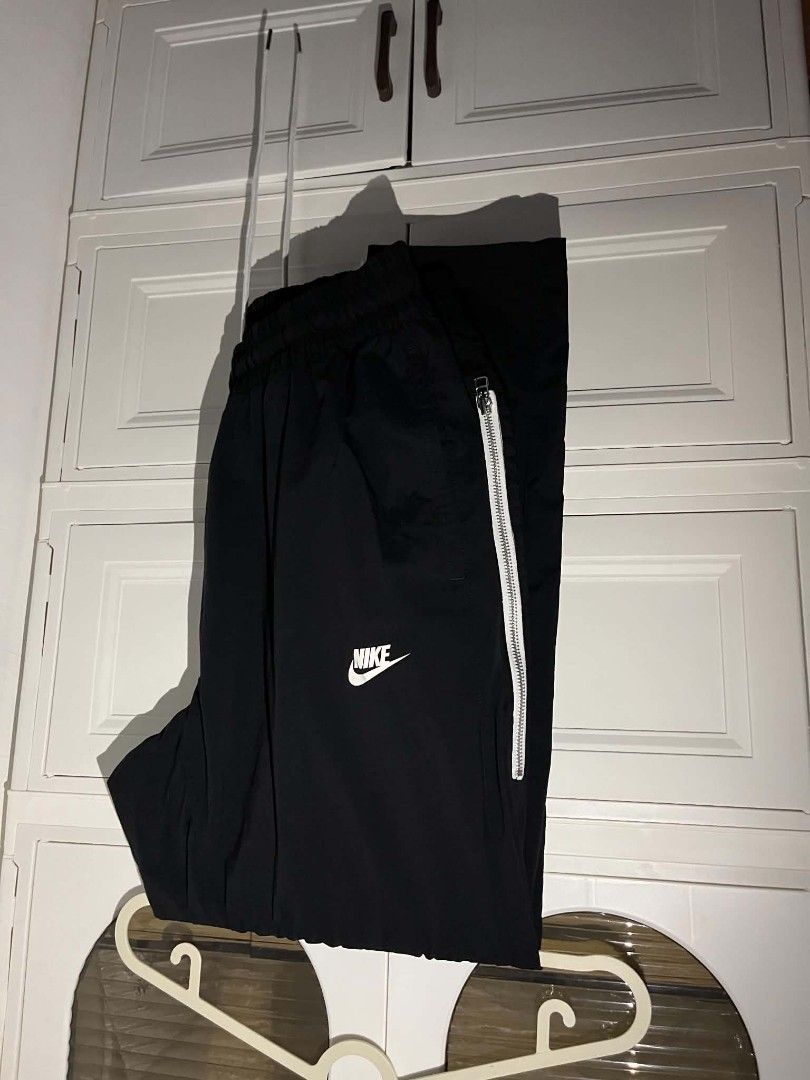 Nike original (Category: Joggers) located in Manila. Submitted by cleverearth.125e3f (Listing ID 1460500811, Image 1). Description: - Two pairs of black Nike pants available. - One pair features stylish white stripe details. - The second pair is the popular Nike Tech Fleece. - Both pairs proudly display the iconic Nike logo. - Ideal for everyday casual wear or athletic activities..