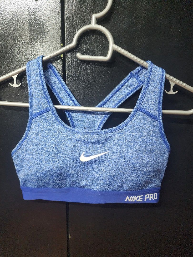 Nike Pro Blue Sports Bra (Category: Activewear) located in Paranaque City. Submitted by bluegreen689 (Listing ID 1460455658, Image 1). Description: - Blue Nike Pro sports bra - Racerback design with criss-cross straps - Breathable fabric for comfort during workouts - Provides excellent support - Features Nike Pro branding on the band and a small swoosh logo - Ideal for running, gym, and active lifestyles size small condition 9/10 rfs: declutterin